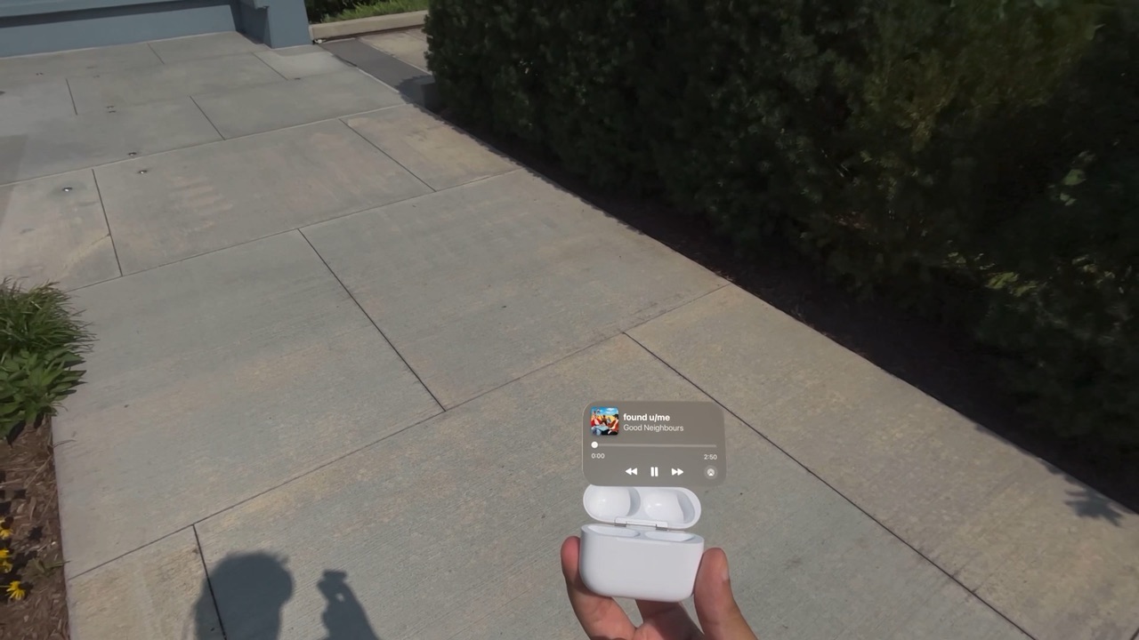 An open AirPods case with a Now Playing card above it: song, scrubber, back, pause and forward