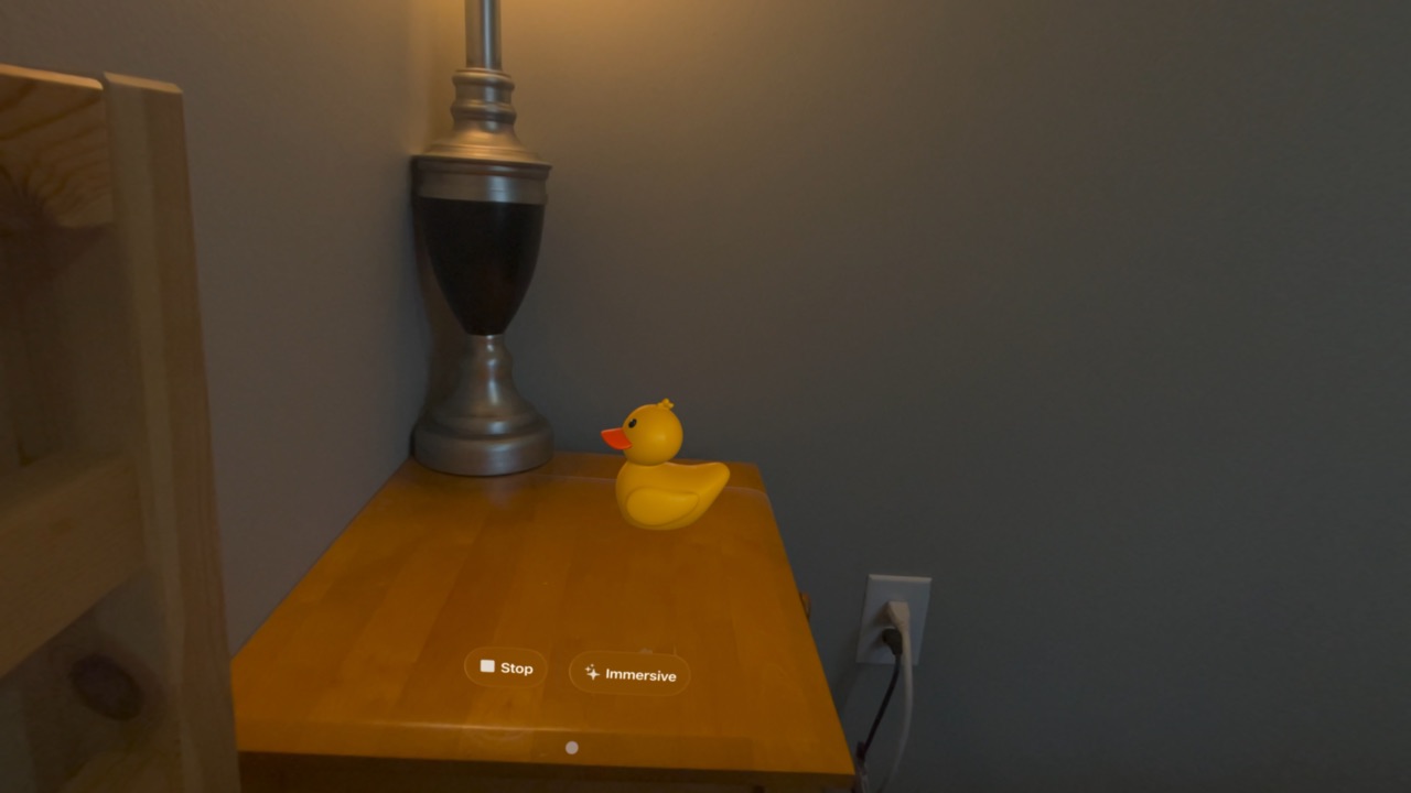 Patito in a small volume on a desk beside a lamp